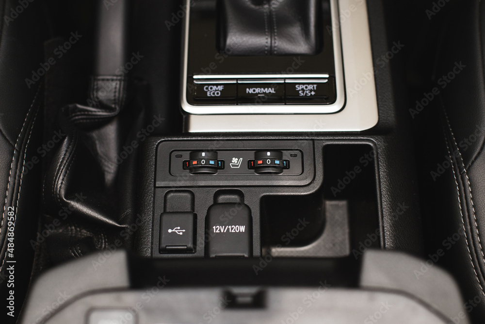 Detail of modern car interior, gear stick, automatic transmission in expensive car Detail of modern car interior, gear stick, automatic transmission in expensive car