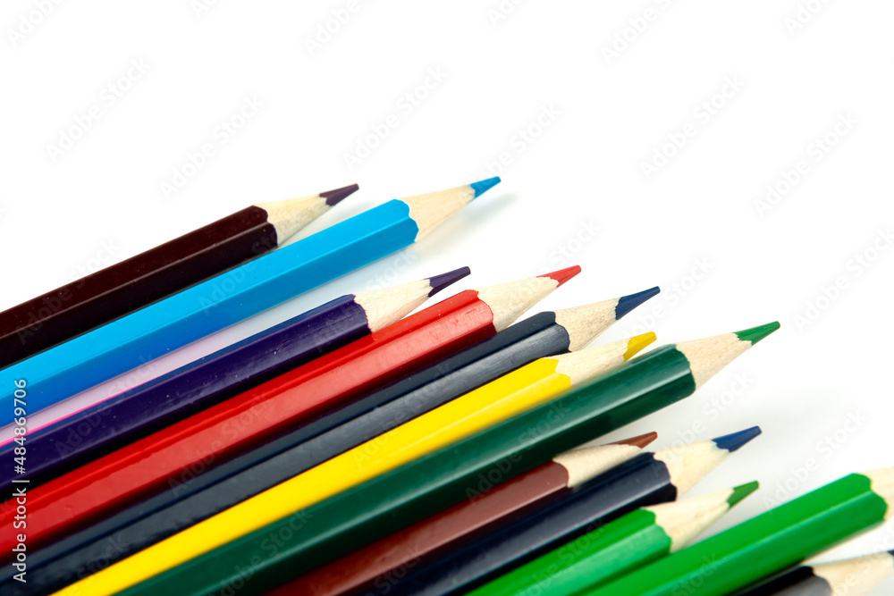 Colored pencils isolated on white background. close-up, copy space Colored pencils isolated on white background. close-up, copy space