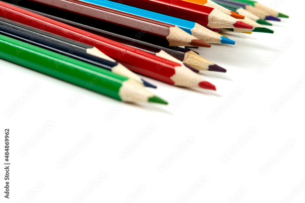 Colored pencils isolated on white background. close-up, copy space Colored pencils isolated on white background. close-up, copy space