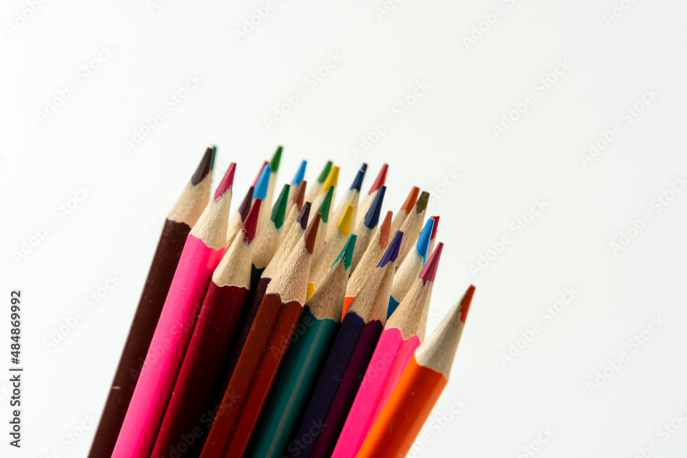 Colored pencils in a stack isolated on a white background. close-up, copy space Colored pencils in a stack isolated on a white background. close-up, copy space