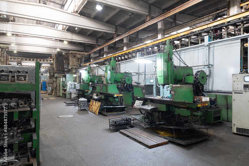 Photo of modern automatic automobile manufacturing workshop. Car production. Industrial scenery background Photo of modern automatic automobile manufacturing workshop. Car production. Industrial scenery background