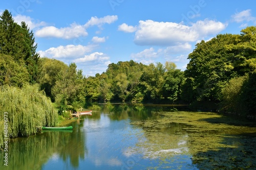 View of Krka river at Kostanjevica na Krki in Dolenjska  Slovenia with trees on the banks in summer