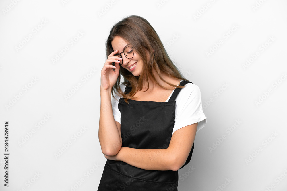 Young caucasian restaurant waiter woman isolated on white background laughing Young caucasian restaurant waiter woman isolated on white background laughing