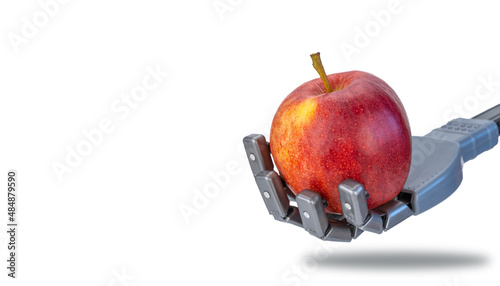 fingers squeeze a fresh apple in the robots hand. future technologies and ecology. robotics applicable in agriculture and natural products trade. artificial intelligence and nature.