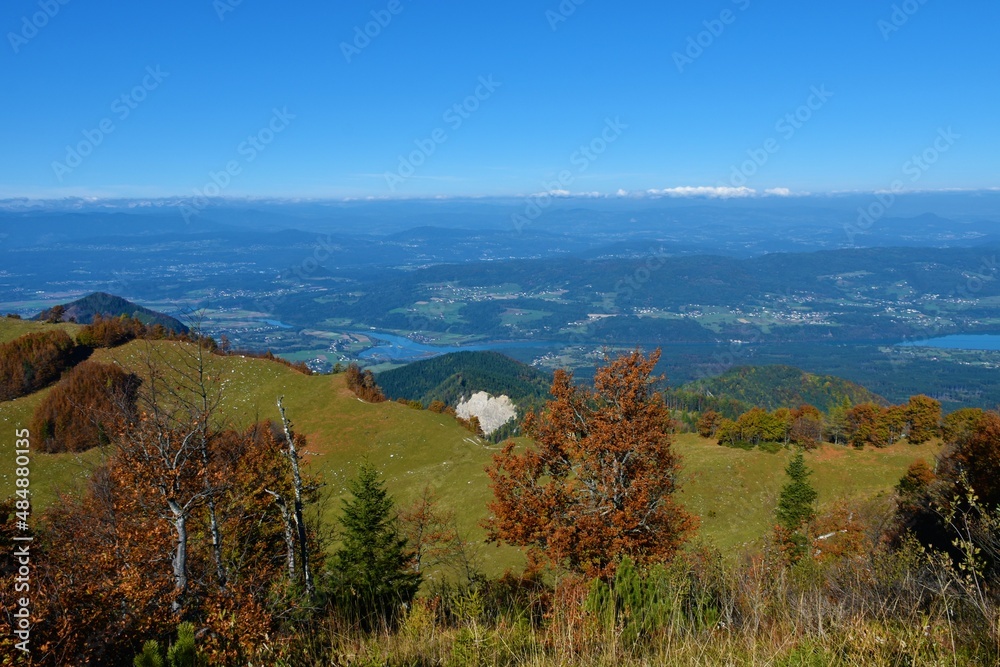 Austrian region of Carithia with snow mountain peaks in the alps from Karavanke mountains in autumn Austrian region of Carithia with snow mountain peaks in the alps from Karavanke mountains in autumn