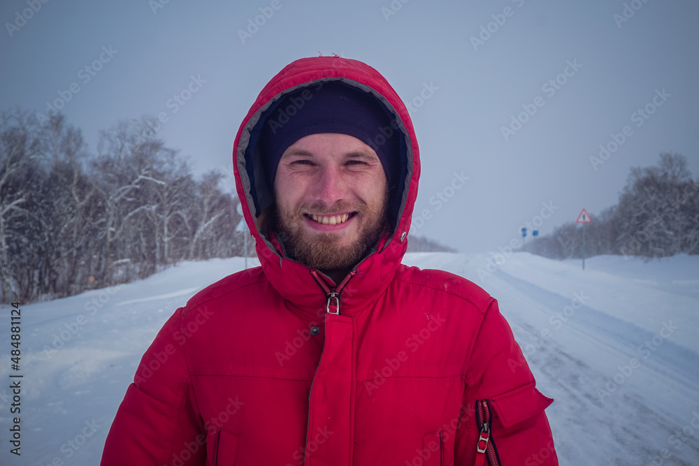 Guy on snowy road in winter