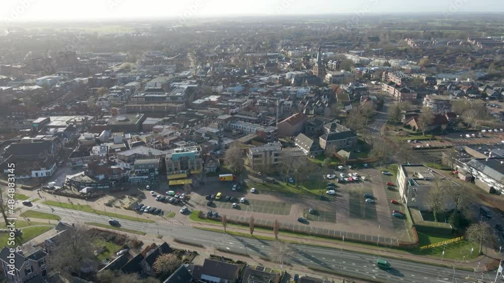 Aerial of beautiful old town center with a large church in the distance. Filmed in Barneveld, the Netherlands Aerial of beautiful old town center with a large church in the distance. Filmed in Barneveld, the Netherlands