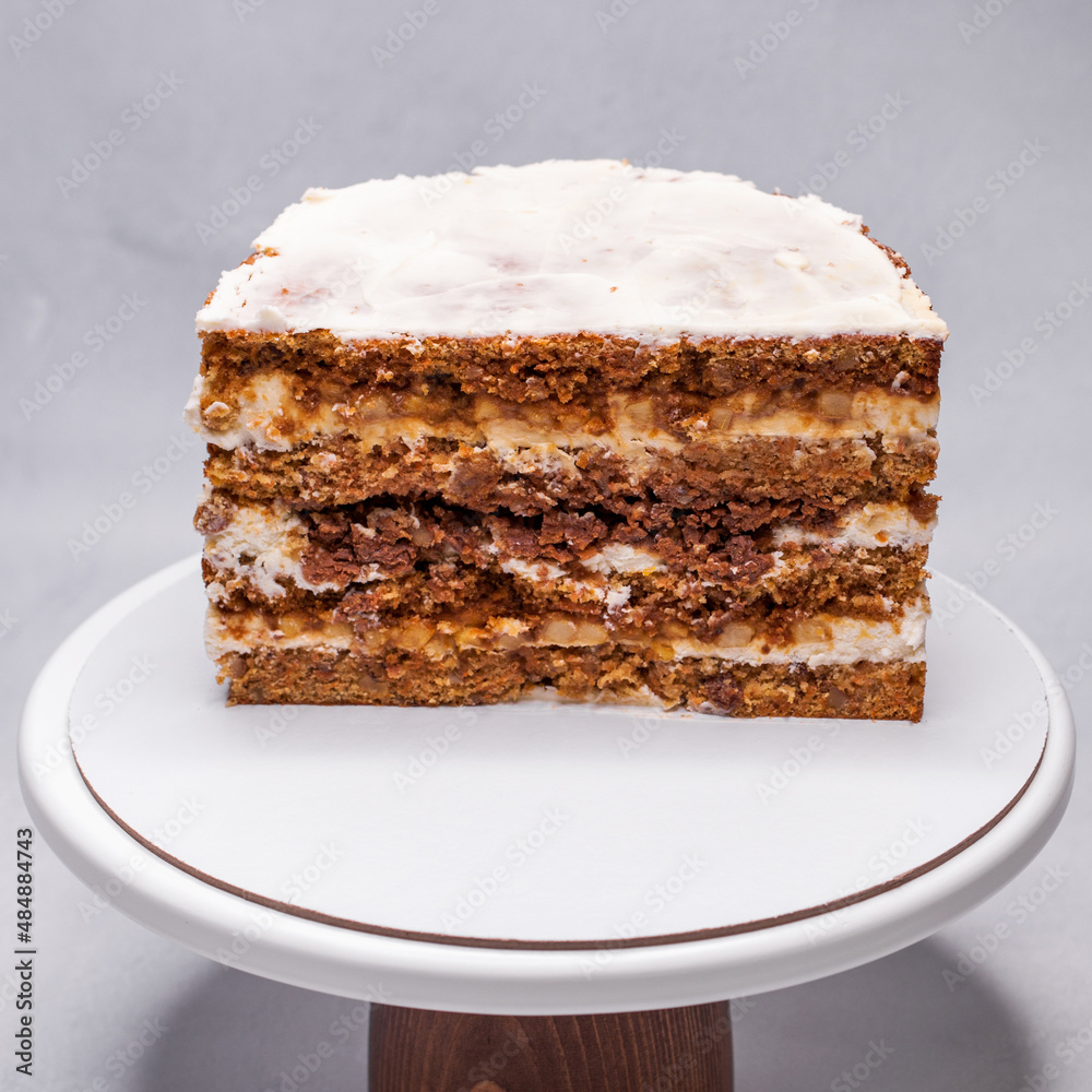 Homemade walnut cake in a section on a stand Homemade walnut cake in a section on a stand