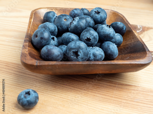 Blueberries in a wooden bowl.