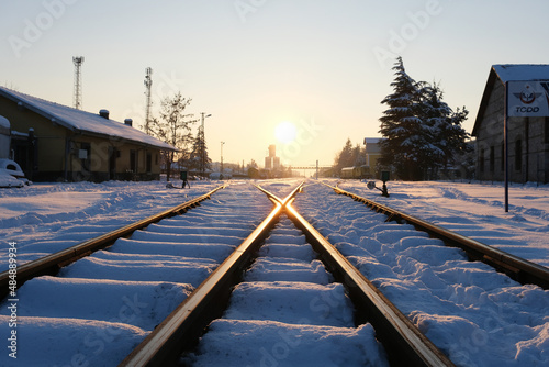 Train station at sunset in winter. Nostalgic Train Station in Turkey's Winter Landscape. German architecture. © exithope