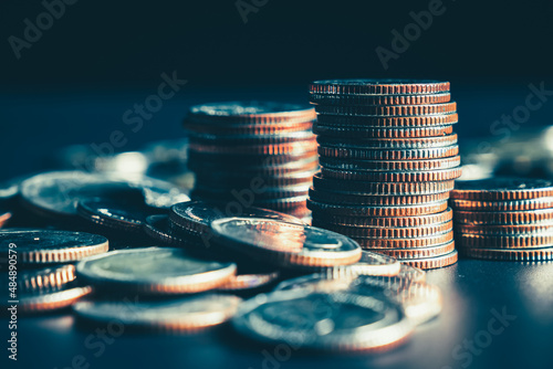 Pile of gold coins money stack in finance treasury deposit bank account saving . Concept of corporate business economy and financial growth by investment in valuable asset to gain cash revenue . photo