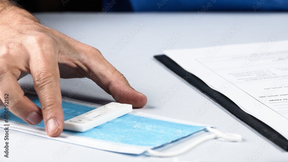 hands of doctor prepares form for covid 19 vaccine 