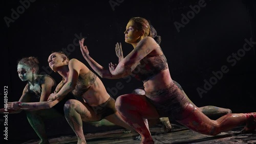 students of art school in dance class, rehearsing modern dance, contemporary choreography