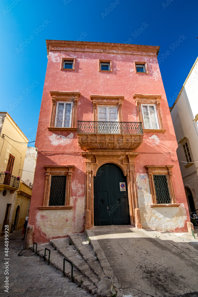 Pink house. Gallipoli, Italy, region Apulia, province Lecce (LE) Travel photography, street view, sunny August summer day.