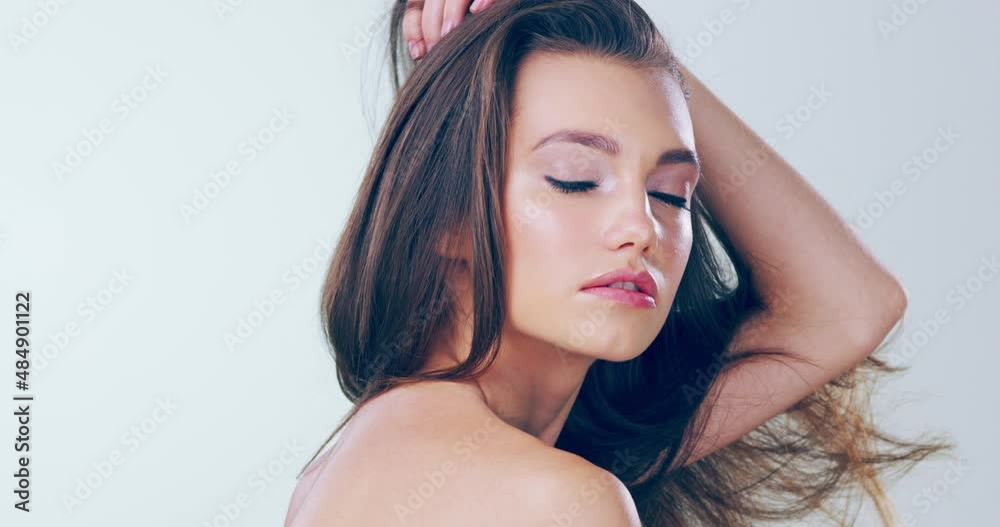 Her beauty will leave you speechless. 4k video footage of a beautiful young woman touching her gorgeous hair in the studio. Her beauty will leave you speechless. 4k video footage of a beautiful young woman touching her gorgeous hair in the studio.