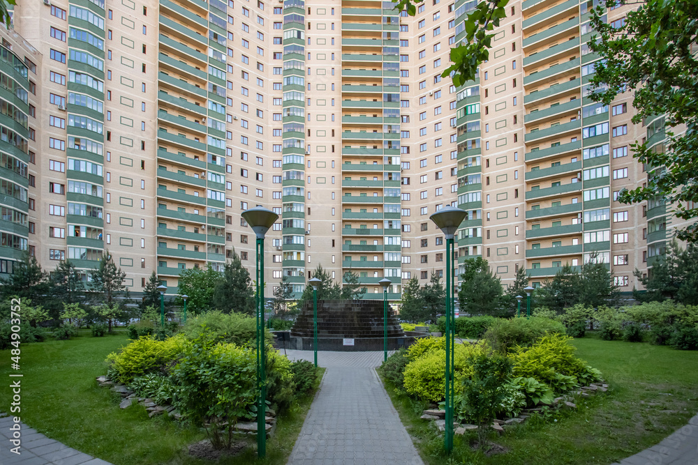 Park in the background of a multi-storey residential building, St. Petersburg, Russia