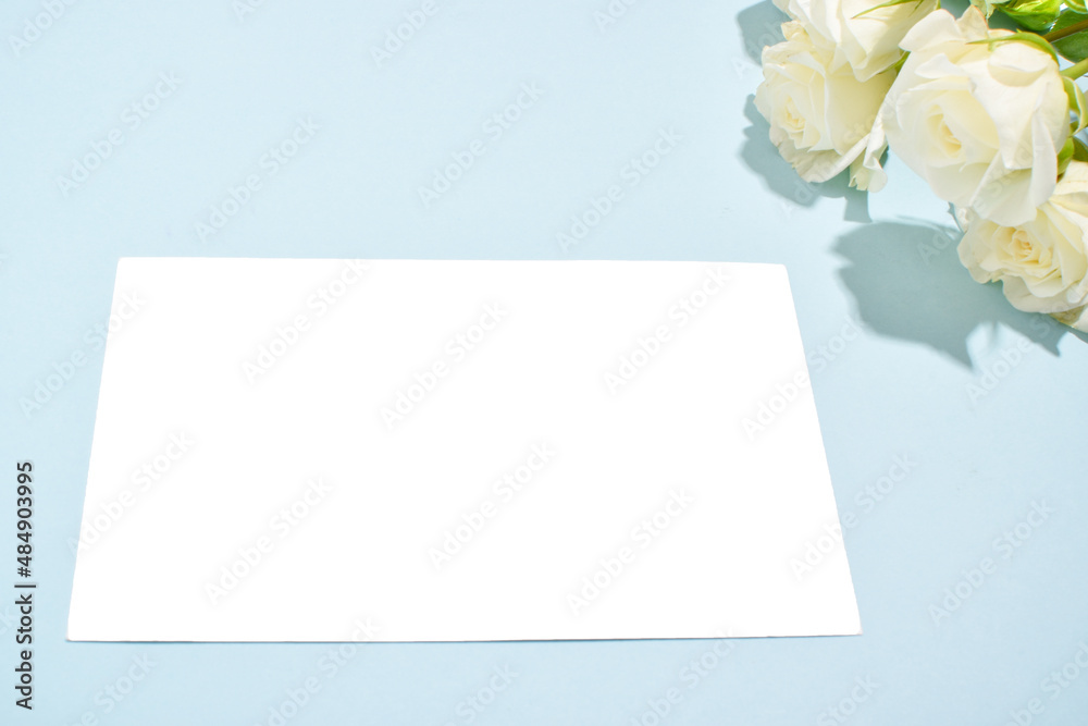 Flowers and a blank sheet of paper. Postcard. Flowers and a blank sheet of paper. Postcard.