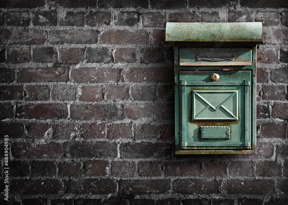 Mailbox on an old brick wall. Bricks wall with mailbox.