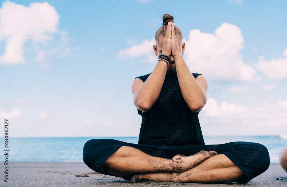 Nature is the perfect yoga partner. a man practicing the triangle pose  during his yoga routine at the beach Stock Photo - Alamy