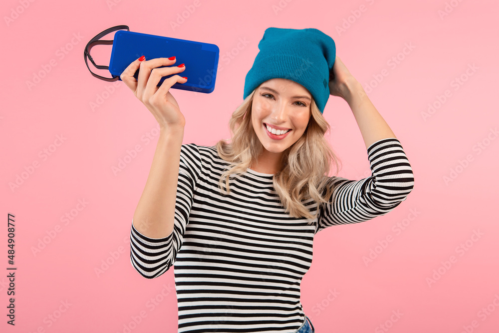 young woman holding music speaker young woman holding music speaker