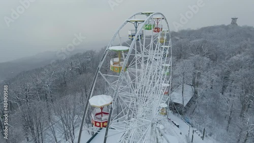 Ferris wheel on top of Mount Akhun during a snowfall. Sochi. Tourist attraction photo