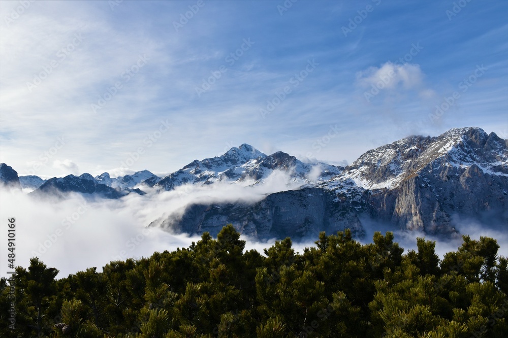 View of Triglav mountain peak in Julian alps, Slovenia with fog covering the alpine landscape bellow