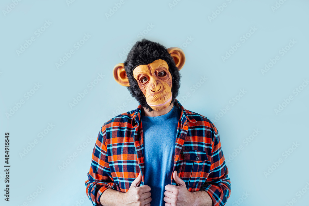 Man in monkey mask gesturing. Man in monkey mask gesturing.