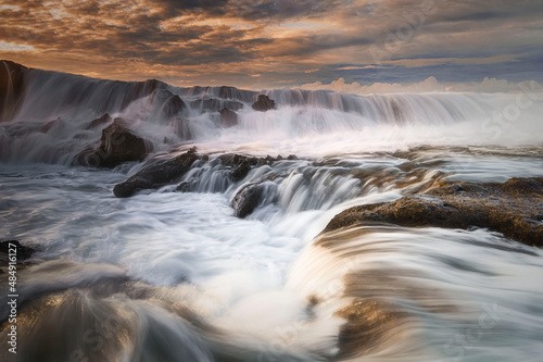 Beautiful sky and wave flow on the beach
