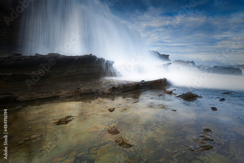 Beautiful sky and wave flow on the beach