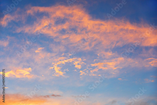 Blue sky at sunset. Orange and pink landscape