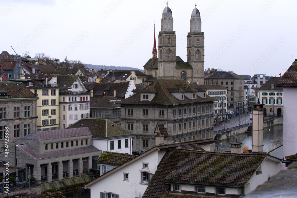 Protestant church Great Minster at the old town of Zürich with gray sky background on a winter day. Photo taken February 1st, 2022, Zurich, Switzerland.
