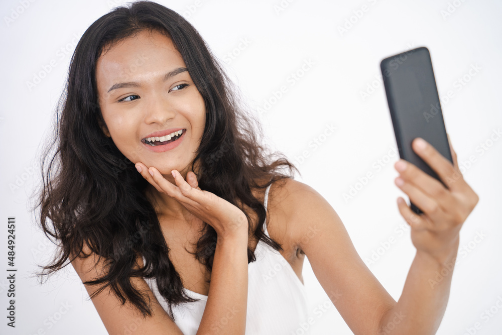 beautiful young asian woman taking selfie using her phone beautiful young asian woman taking selfie using her phone