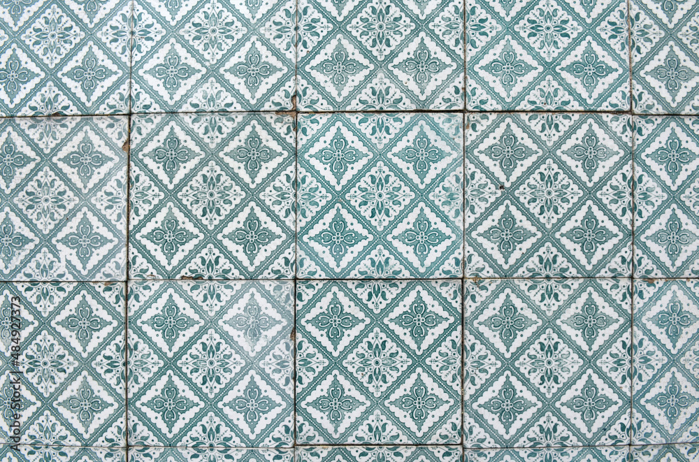 old damaged tiles in Portugal,green and white, photography takes in buildings of Portugal old damaged tiles in Portugal,green and white, photography takes in buildings of Portugal