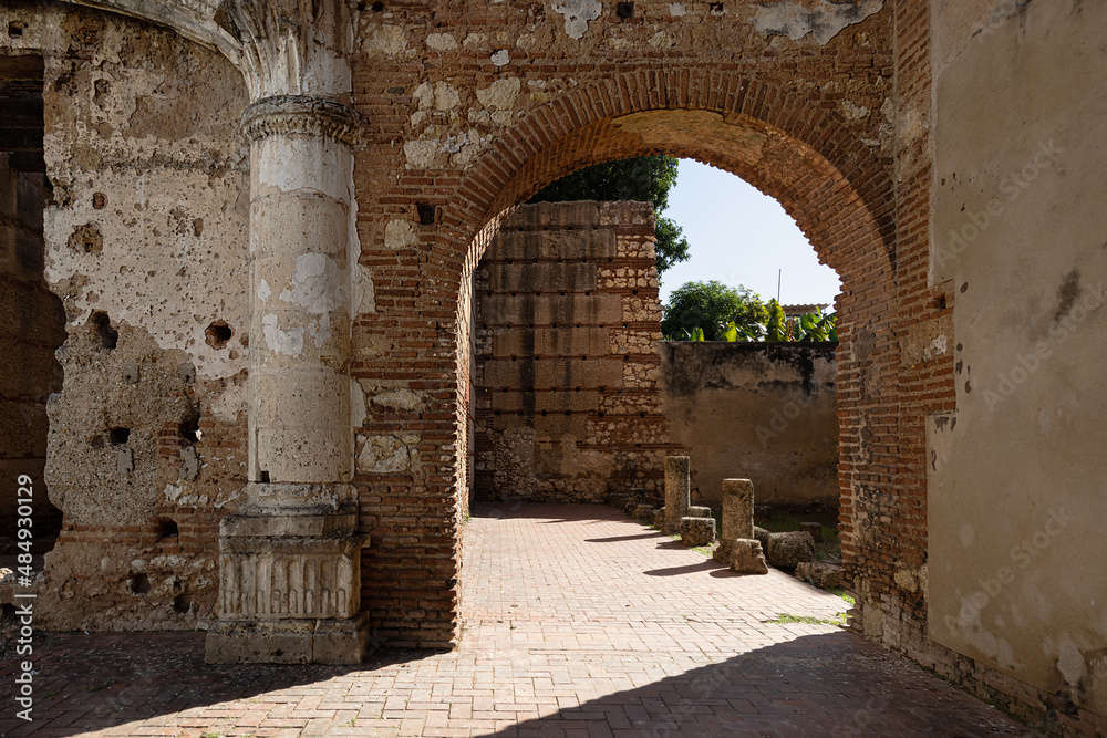 selective focus on ancient ruins of the first American hospital, San Nicolás de Bari in Santo Domingo, early 16th century. Arches, columns and walls of red brick and cobblestone