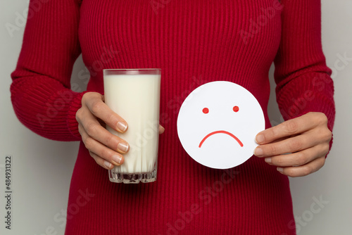 Pain in abdomen from milk. Lactose intolerance. photo