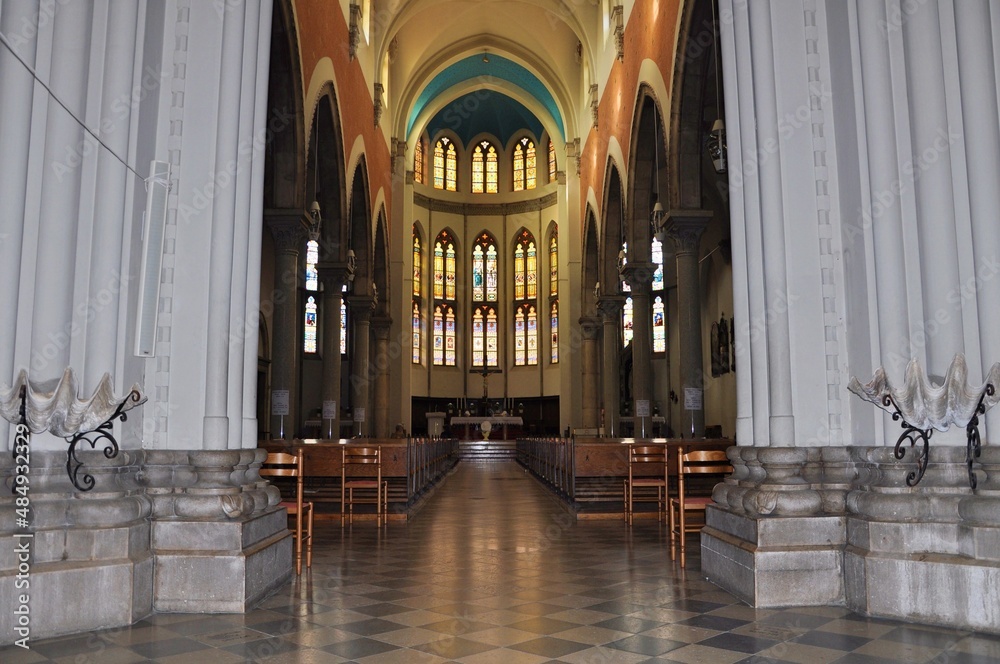 Fototapeta premium Central altar and stained glass windows in the background of the Capuchin Church of Our Lady of Lourdes in Rijeka.The church is a unique example of eclecticism in Rijeka.