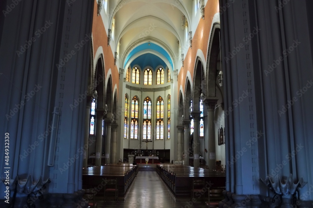 Fototapeta premium Central altar and stained glass windows in the background of the Capuchin Church of Our Lady of Lourdes in Rijeka.The church is a unique example of eclecticism in Rijeka.