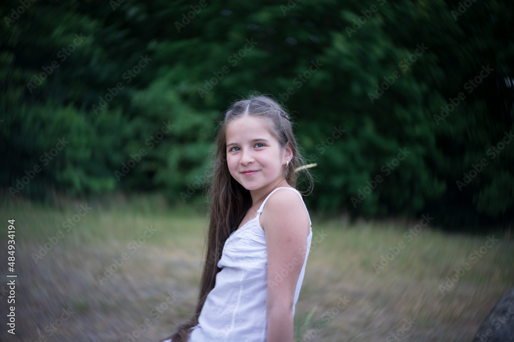 Portrait of a beautiful girl with long hair in nature. Portrait of a beautiful girl with long hair in nature.
