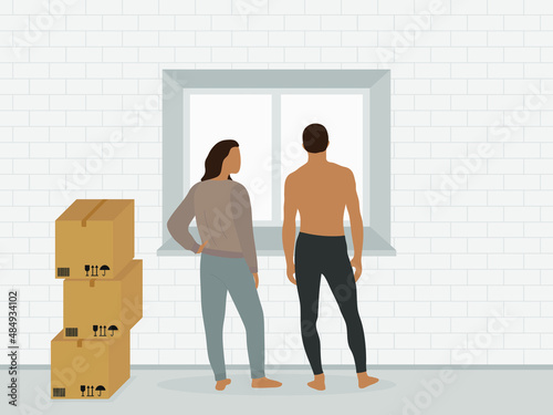 A male character and a female character in home clothes are standing near the window next to the cardboard boxes