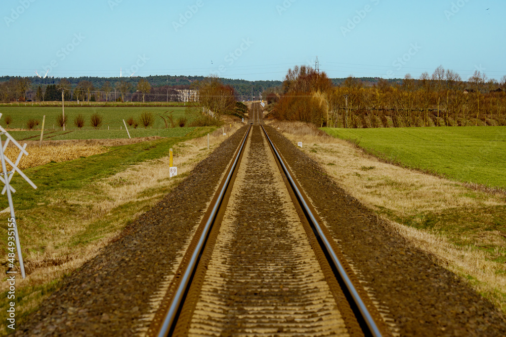 The railway track in the autumn season, the driver's perspective
