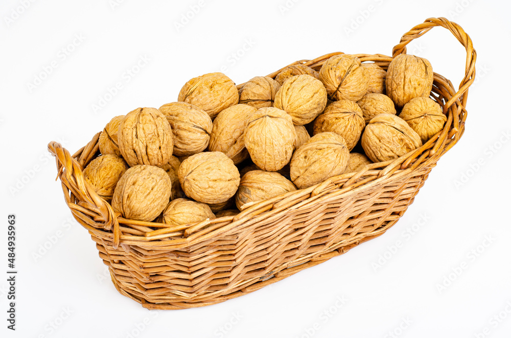 Unpeeled ripe walnuts on white background. Studio Photo Unpeeled ripe walnuts on white background. Studio Photo