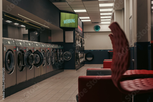 Fotografija Laundromat inside in the evening, washing machines in a laundromat