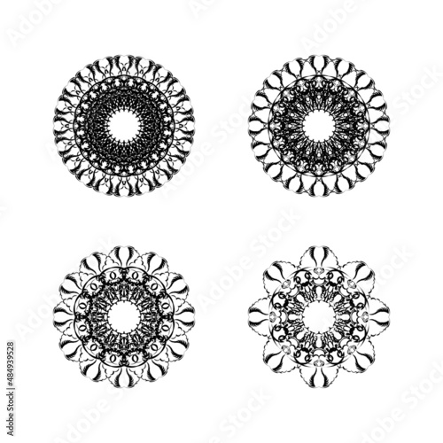 Set of four ethnic round mandala ornaments isolated on white background. Vector illustration. Geometric flower.