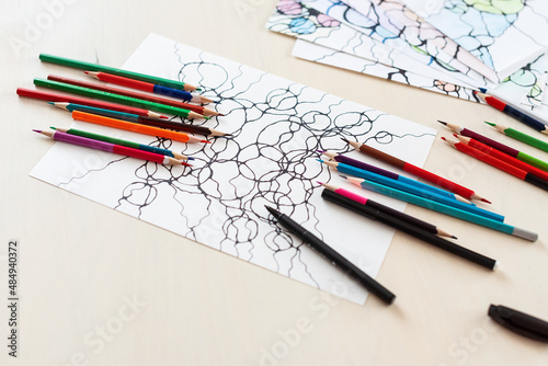 Neurographic art, mental health, creativity, psychology, adult fine motor skills. Abstract neurographic drawing with markers and colored pencils. Colorful neurography.
