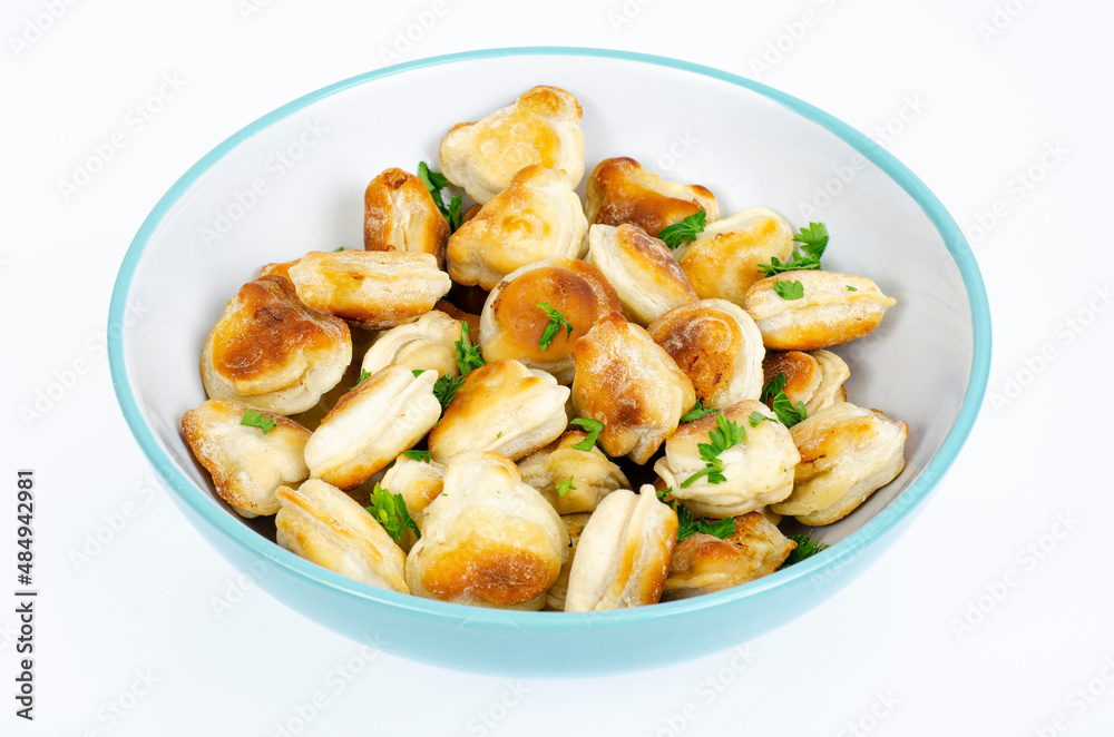 Blue bowl with fried dumplings. Studio Photo Blue bowl with fried dumplings. Studio Photo