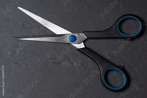  old scissors on a black background