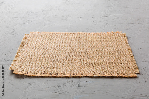 Canvas Print Perspective view of brown tablecloth for food on cement background