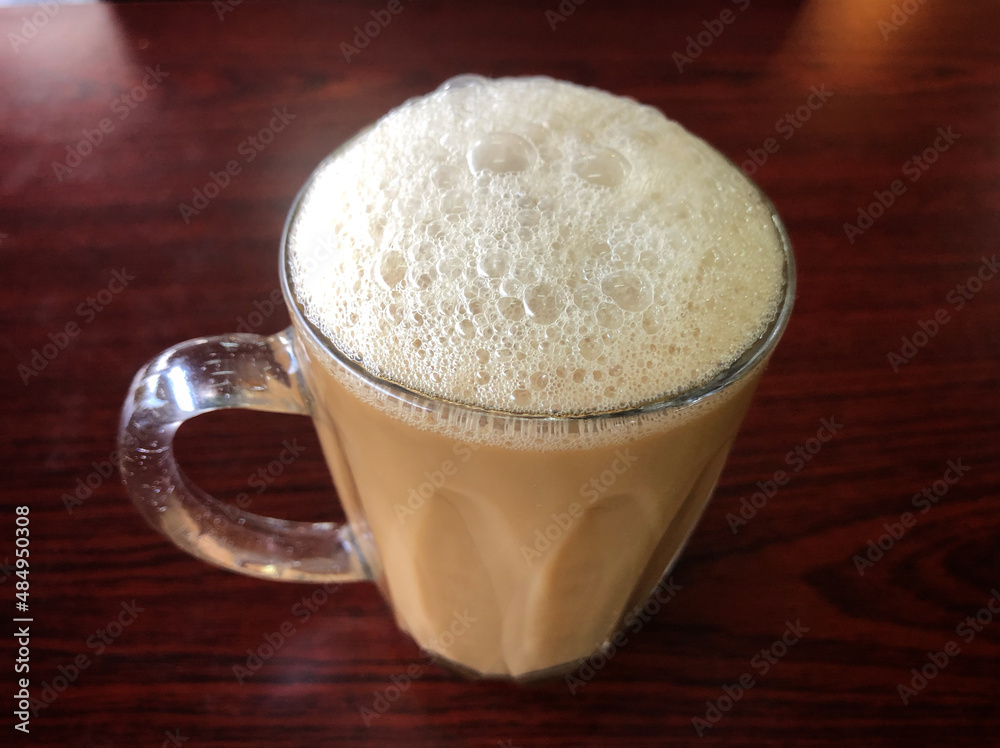 Tea with milk or popularly known as Teh Tarik in Malaysia Tea with milk or popularly known as Teh Tarik in Malaysia