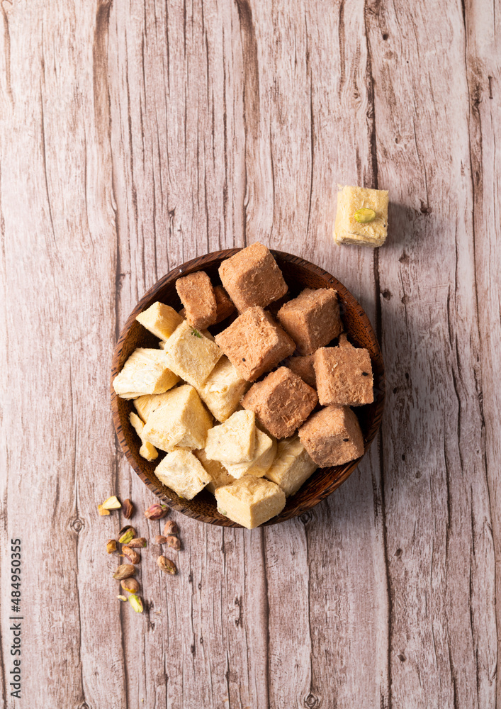 soan papdi, son rolls, patisa on a rustic background