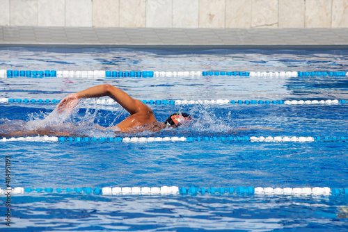 Professional male swimmer swimming in the pool © protivnica